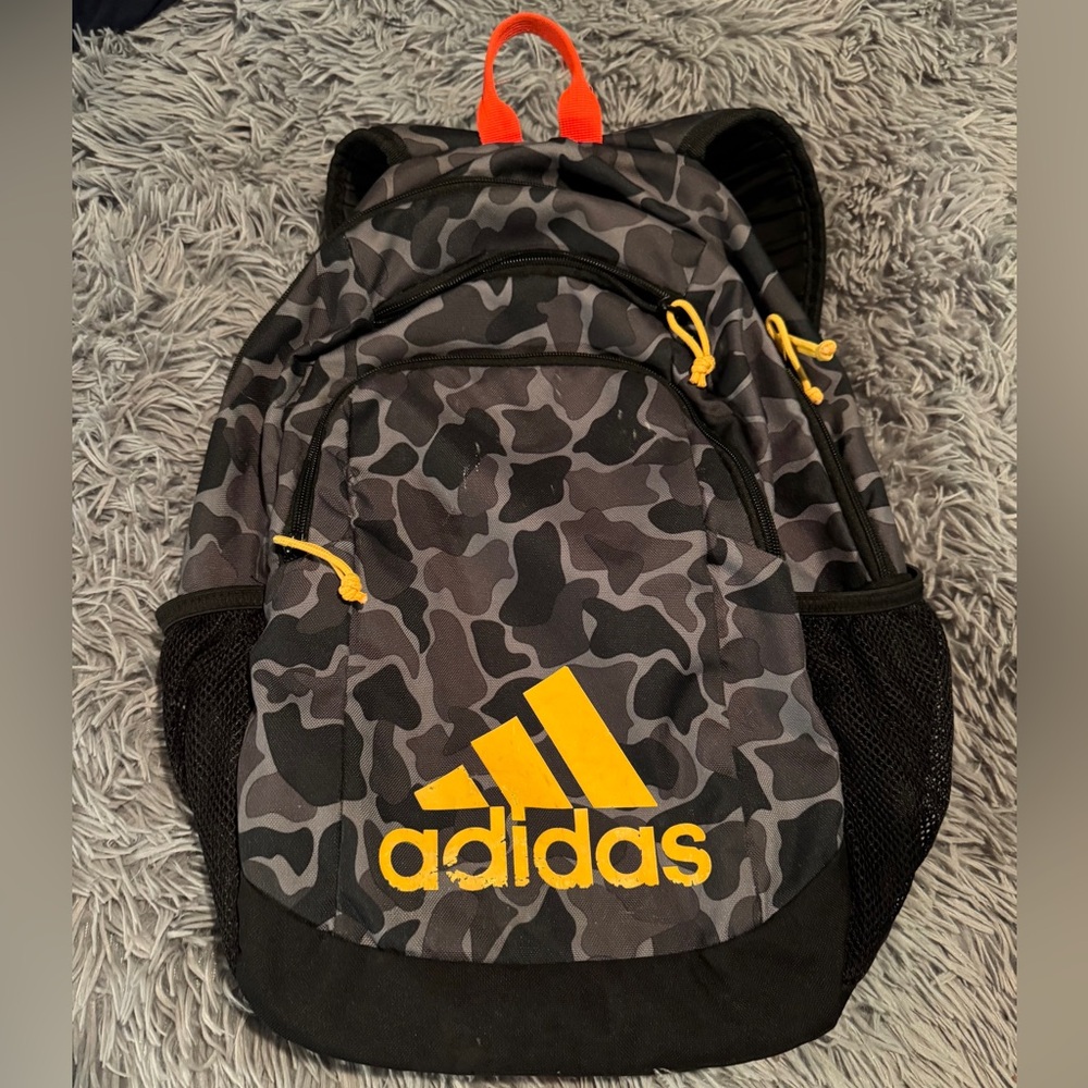 Adidas Gray Camouflage Backpack with Yellow Details it’s in great and by